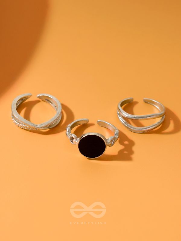  THREE-WAY- SET OF THREE BLACK AND SILVER RINGS
