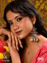 GAJASANKHA KARṆIKA- ELEPHANT-SHELL EARRINGS- OXIDIZED EARRINGS FEATURING AN ELEGANT MOTIF, DELICATE GHUNGHROO'S, AND COWRIE SHELLS